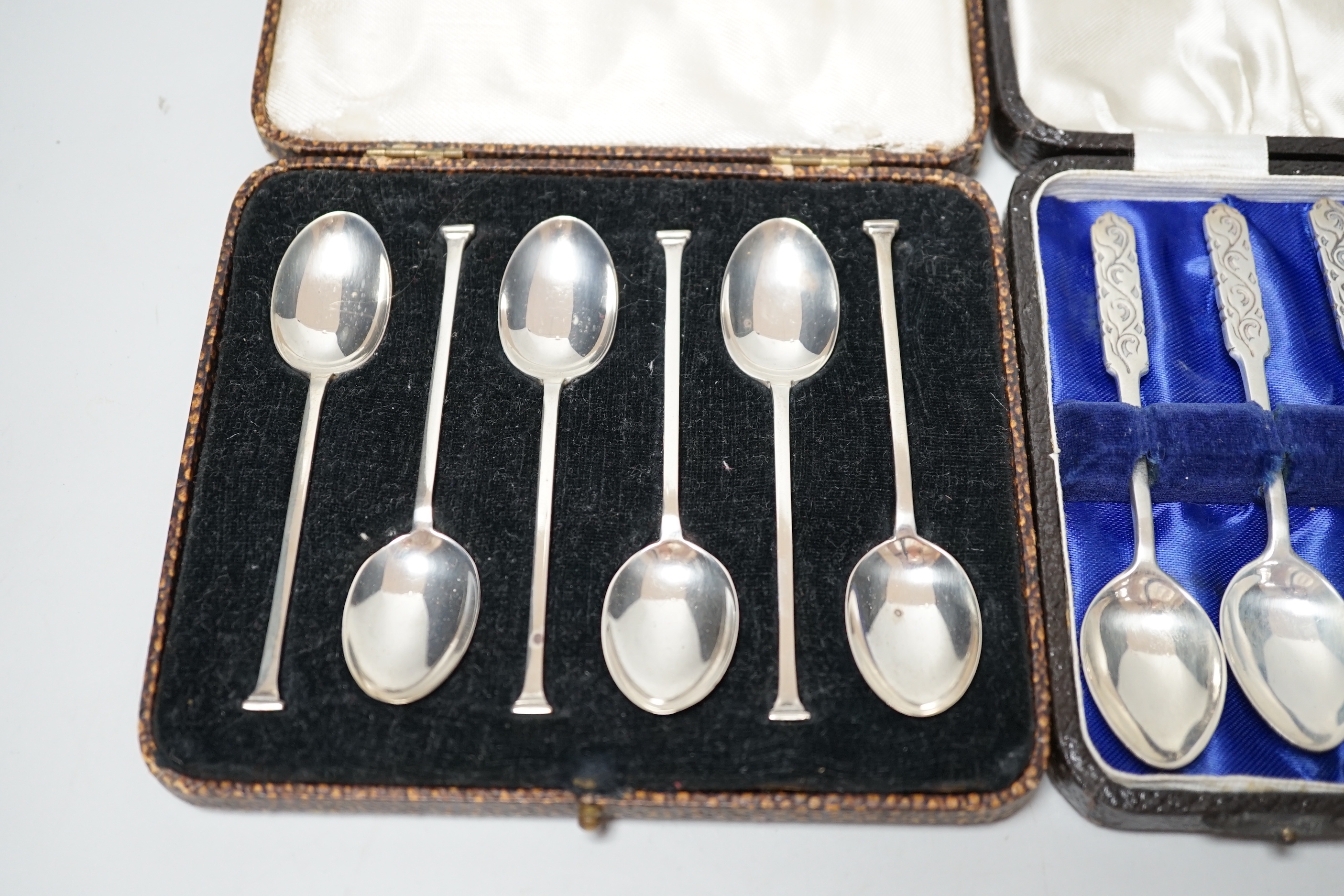 Two cased sets of six silver teaspoons including J.A. Restall Ltd, Birmingham, 1945, retailed by Liberty & Co.